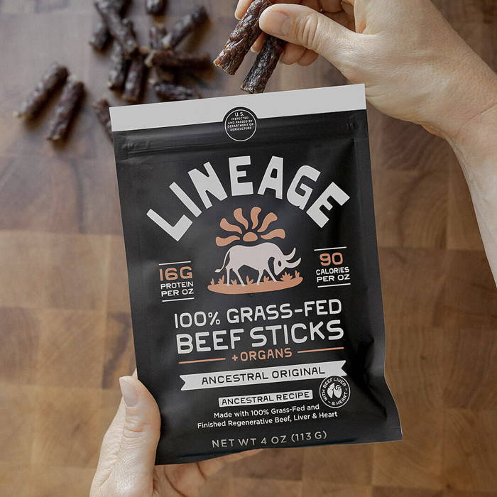 Lineage grass-fed beef meat sticks high protein snack, Lineage beef meat sticks grass-fed portable protein snack, Lineage grass-fed beef snack sticks packaged product, Lineage beef meat sticks ancestral protein snack, Grass-fed Lineage beef meat sticks ready-to-eat snack, Lineage high protein beef meat sticks product image, Lineage grass-fed beef snack sticks natural protein snack, Lineage beef meat sticks clean ingredient protein snack, Packaged Lineage grass-fed beef meat sticks, Lineage beef snack sticks high protein portable snack, Grass-fed beef meat sticks from Lineage protein snack, Lineage ancestral beef meat sticks whole food snack, Lineage beef meat sticks protein snack product shot, Grass-fed Lineage beef snack sticks packaged snack, Lineage beef meat sticks natural high protein snack